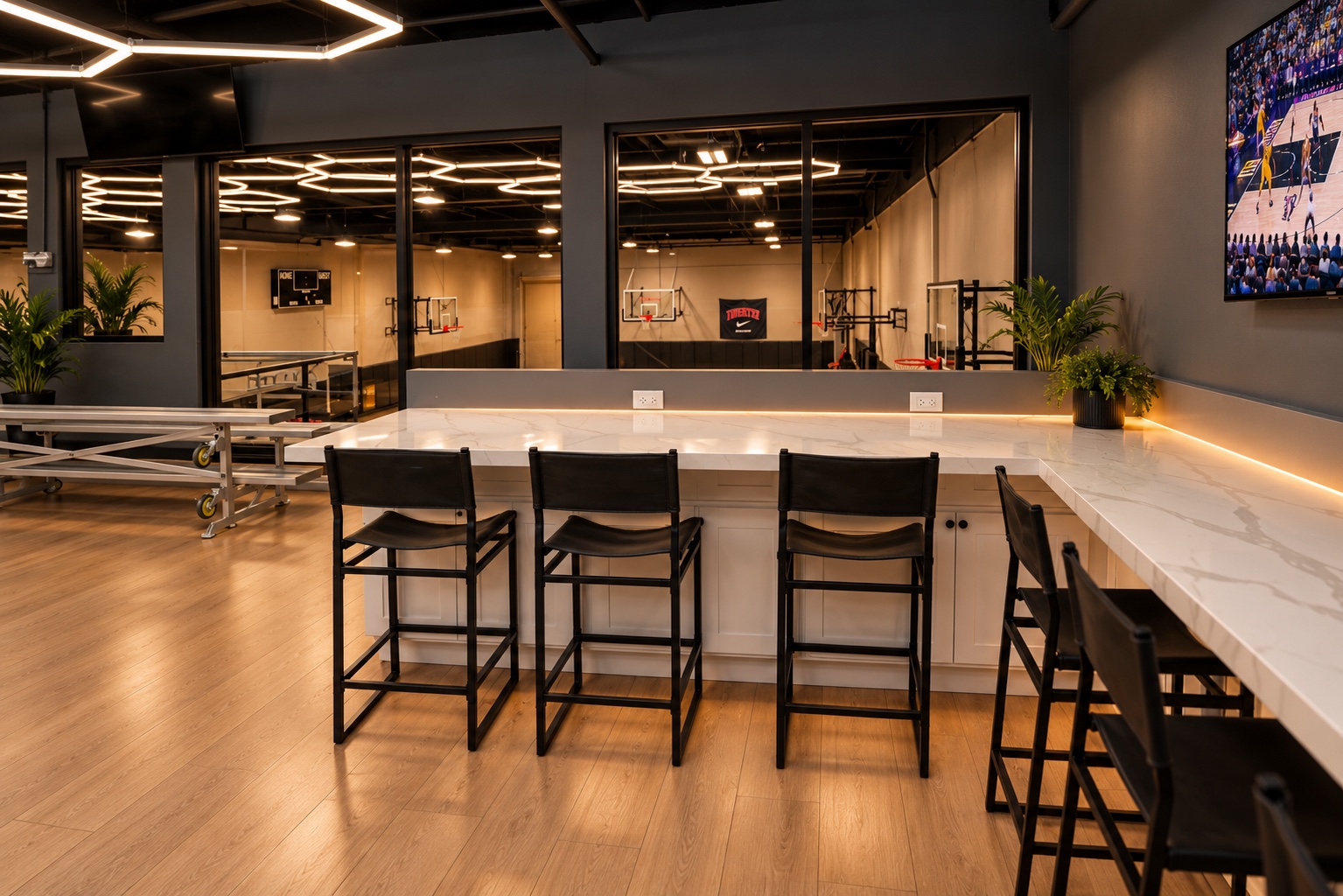 Upstairs bar seating overlooking the basketball court