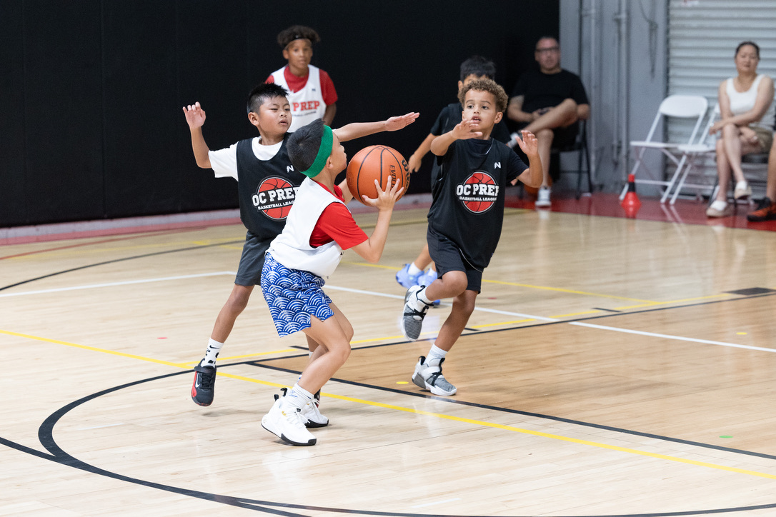 Kids playing OC Prep youth basketball at OC Hoop Legends