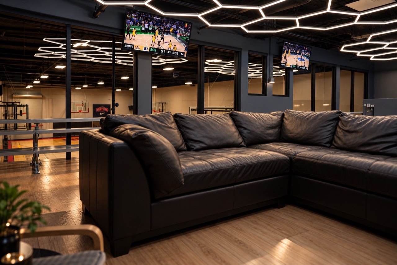 Comfortable mezzanine lounge with a clear view of the court